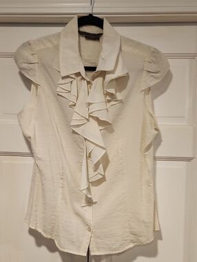 To the Max Cream Ruffle Front Sleeveless Blouse